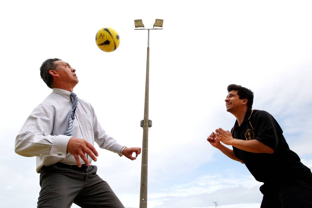 Warrnambool Wolves Football Club president Carlos del Rio (right) goes head to head with Warrnambool mayor Mike Neoh after yesterday’s start on a $305,000 lighting upgrade at the Harris Street Reserve soccer fields.  
