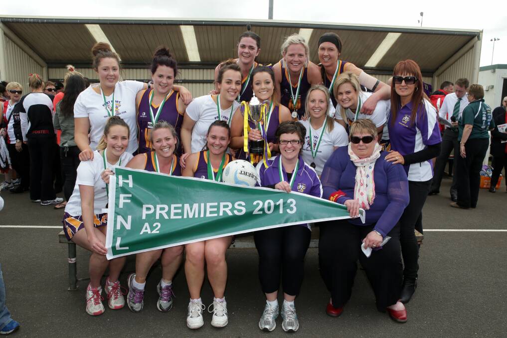 Port Fairy's winning A2 netball side: from back left: Gina Canfield, Naomi Harman, Stef Lovell, Georgia Moloney, Grace White, Bridget O'Dwyer, Jemmah Lynch, Kristy Pruin, Caitlin Pulham, Leonie Boyd and (front from left) Alanah Bannam, Stacey Dwyer, Elise Wood, coach Alanah Edwards and manager Fiona Canfield. Picture: DAMIAN WHITE