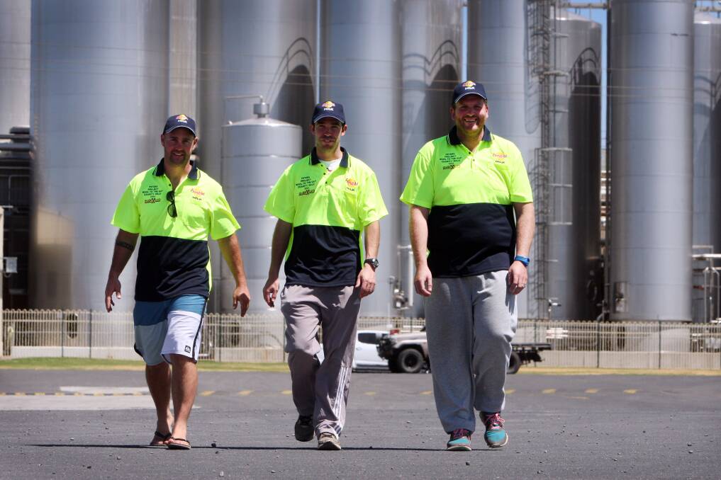 Ready to go: Warrnambool Cheese and Butter workmates Justin Christoforou (left), Sam Miller and Jeremy Burgess.  