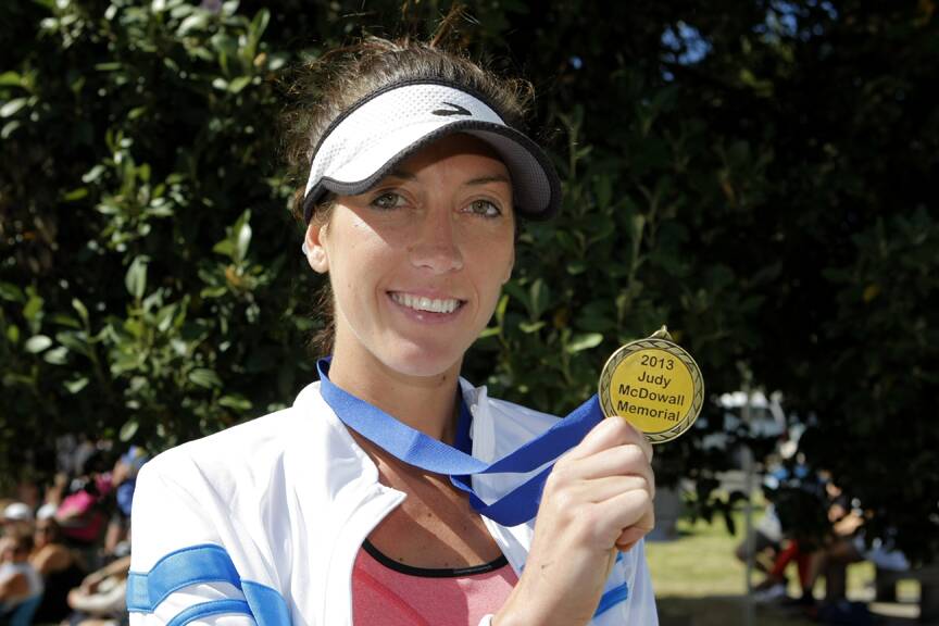  Ella Gill, of Warrnambool, with the Judy McDowall Memorial medal for winning the Womens 10km run.