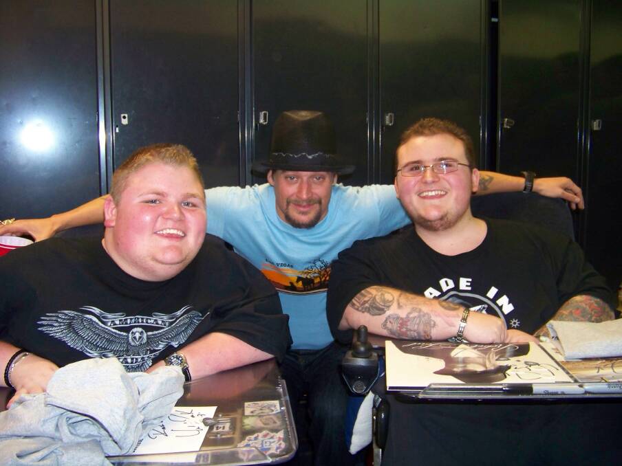 Christopher (left) and Aaron Gillin accomplish their mission of meeting musician Kid Rock. 