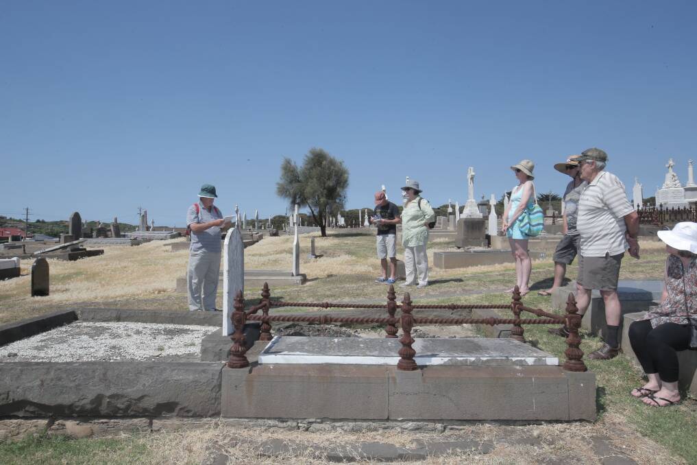 Ray Welsford (left) leads a group of local history buffs on a tour of the Warrnambool cemetery to the graves of prominent figures in the 125-year history of the Warrnambool Cheese and Butter factory.