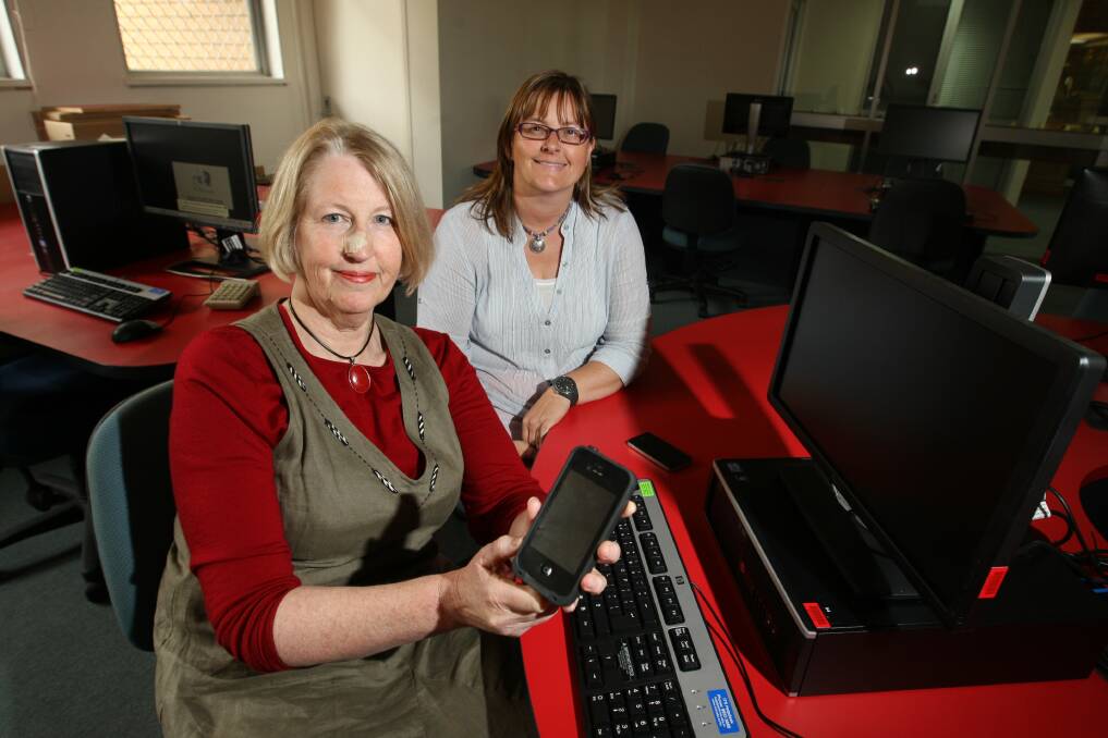 RMIT Hamilton senior manager Dr Kaye Scholfield (left) and Hamilton Regional Business Association executive officer Jane Barrie compare notes about the impact of the Telstra communications failure in the city.