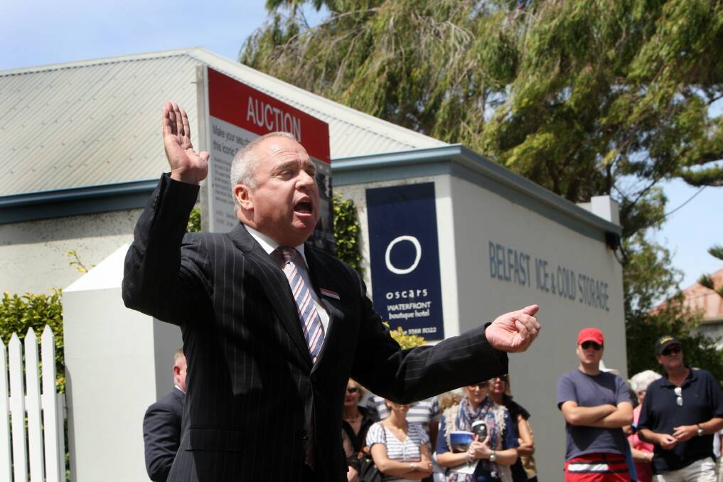 Auctioneer Peter Perrigon from real estate agents hockingstuart calls for bids on Port Fairy property Oscars Waterfront Boutique Hotel on Saturday.