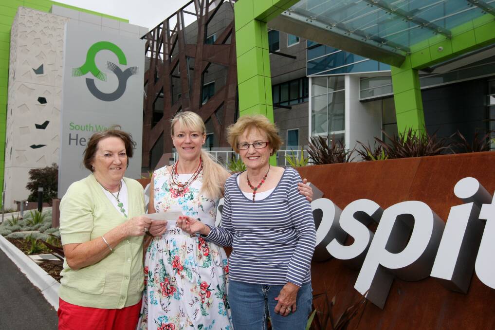 South West Healthcare’s community partnerships manager Suzan Morey (centre) is presented with a $10,000 cheque by Pauline Burleigh (left) and Judi Doherty, the money raised by the Lucky 7 Cancer Bingo group.   