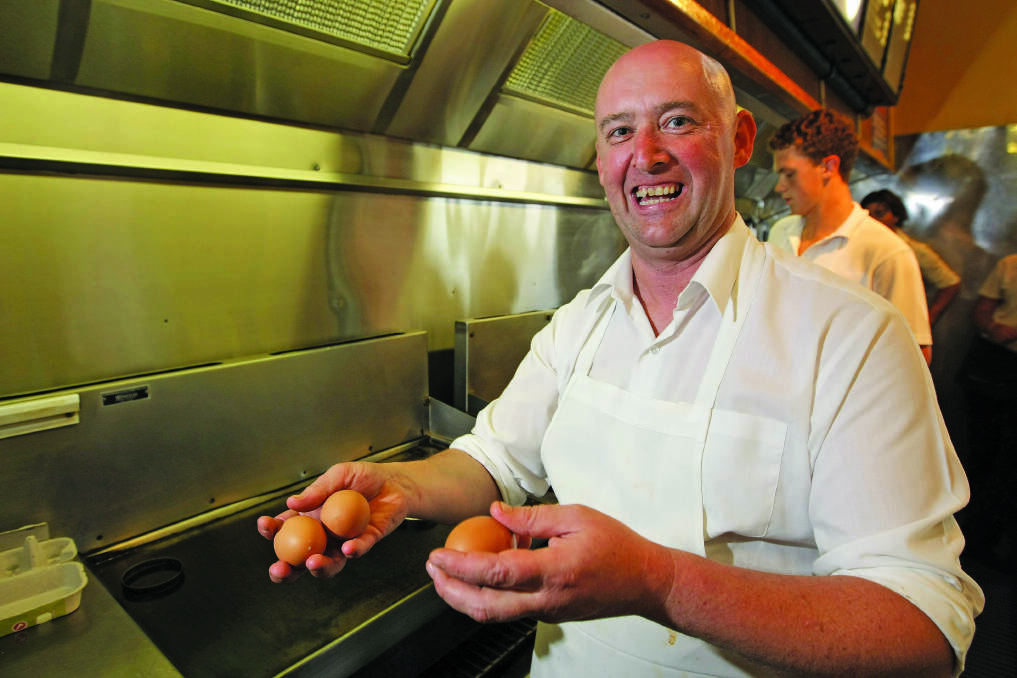 Brett Healey from Kermond’s Hamburgers was back at work with more conventional eggs yesterday after serving up a four-yolker (next photo) last Saturday.