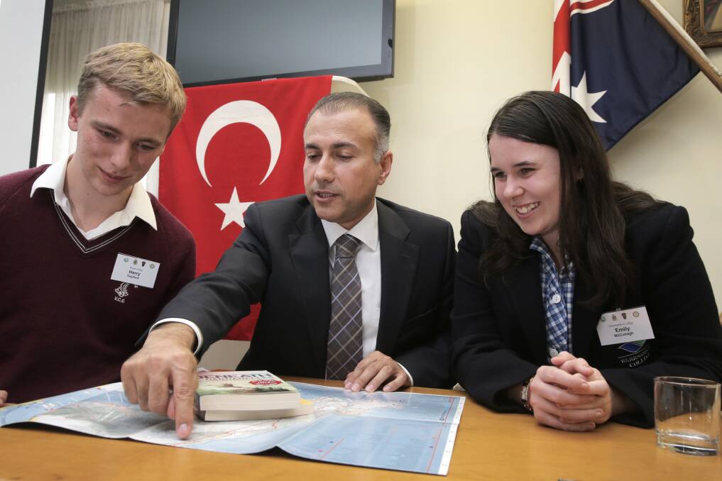 Brauer College student Harry Twyford and Warrnambool College’s Emily McCullagh study a map with Turkish Consul General Mehmet Apak ahead of their trip to the country next year.