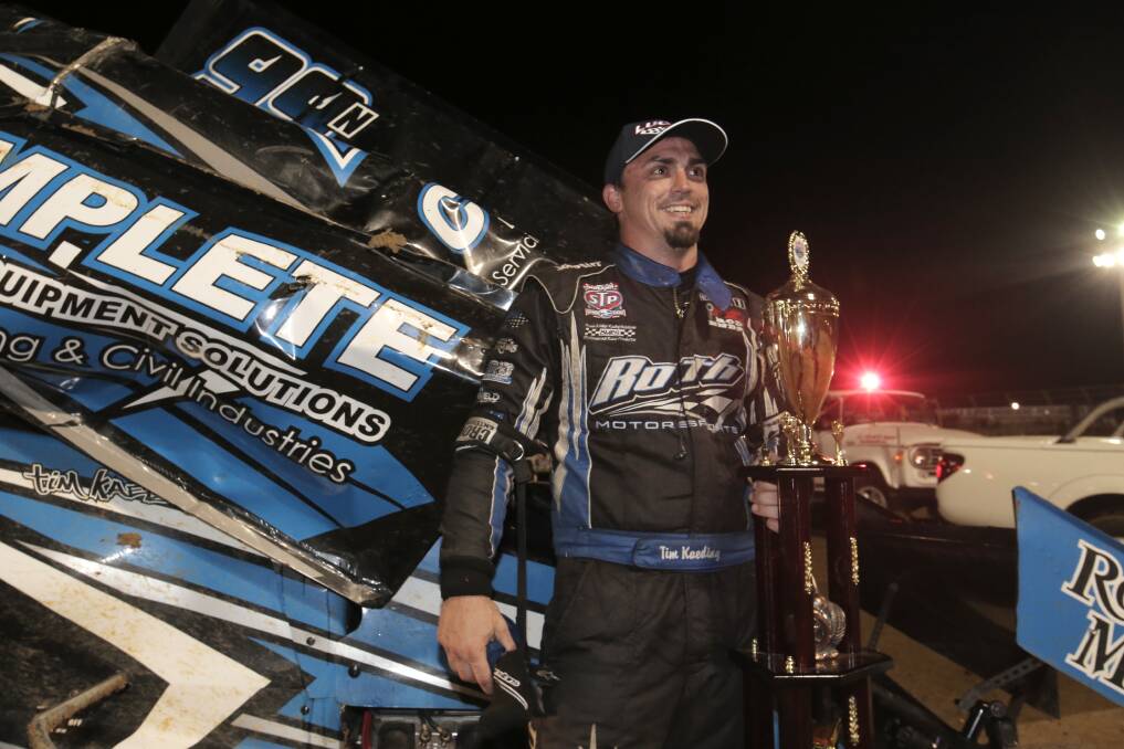 Grand Annual Sprintcar Classic winner Tim Kaeding celebrates after his victory at Premier Speedway. 