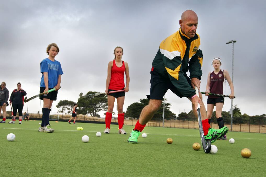 Australian over-50s hockey coach and former local Phil Frost was back in town on the weekend to pass on some tips to young Warrnambool and District hockey Association junior academy members including Joe Nelson-Hill (left), 11, Daniella Nelson-Hill, 14 and Kelsey Ratcliffe, 12.
