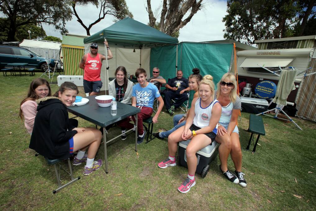 Happy campers at Fig Tree Holiday Park in Warrnambool - Geelong families have been coming to the park for more than 10 years. L-R Laila McLennan 11, Emily Krahe 14, Chris Wild, Marlee Robinson 17, Ben Krahe 16, Craig McLennan, Garry Krahe, Danielle Lagarde 18, Maddie Janssen 17 and Helen Janssen. 121228DW01 Picture DAMIAN WHITE