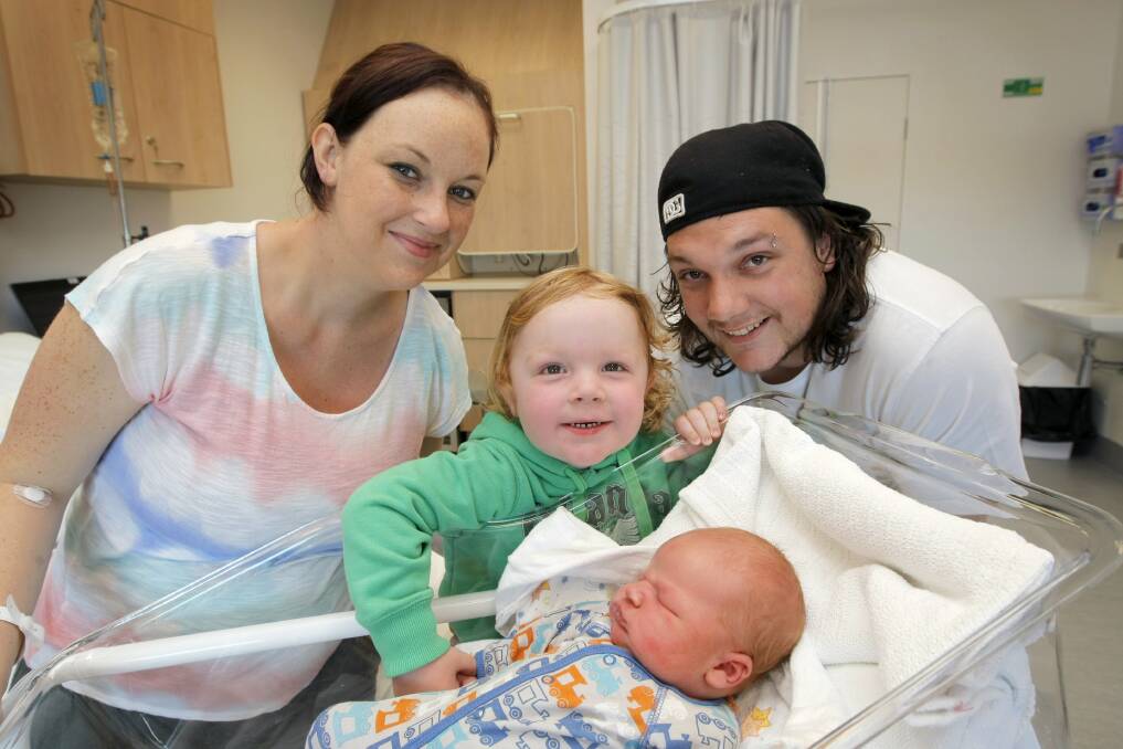 The south-west's first 2013 baby Koby Clarke is greeted by parents Jena Robertson and Matthew Clarke and older brother Noah, 2.