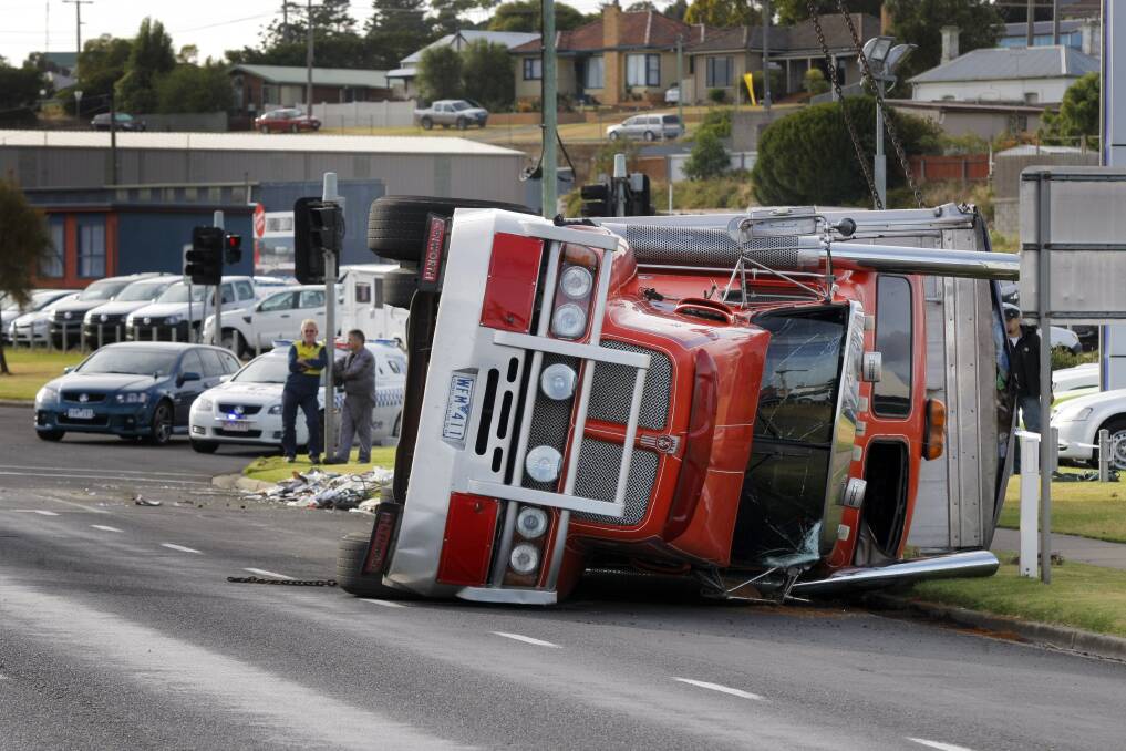 A truck carrying rubbish came to grief along Raglan Parade