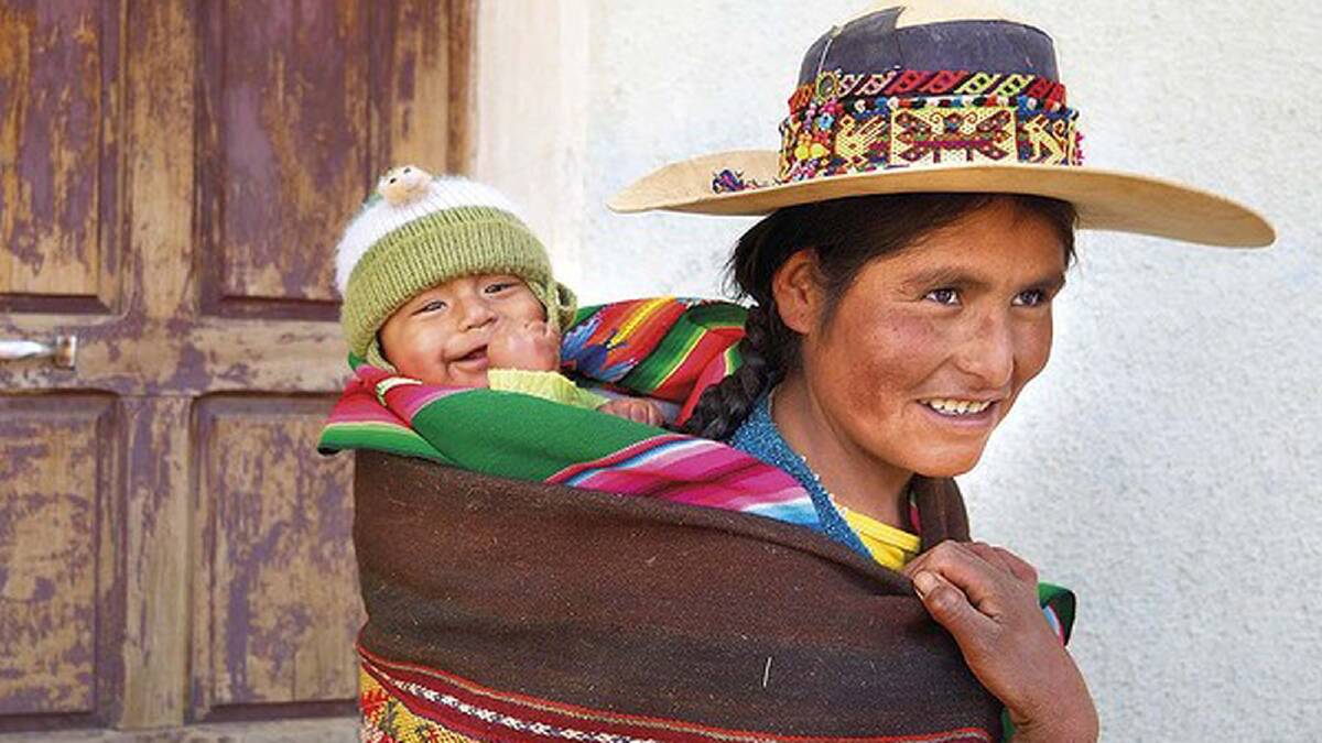 All aboard! Rosaura with happy passenger Luis in North Potosi, Bolivia. She says that what mothers in her area need is access to “better nutrition, better food.” Photo: Steve Fraser