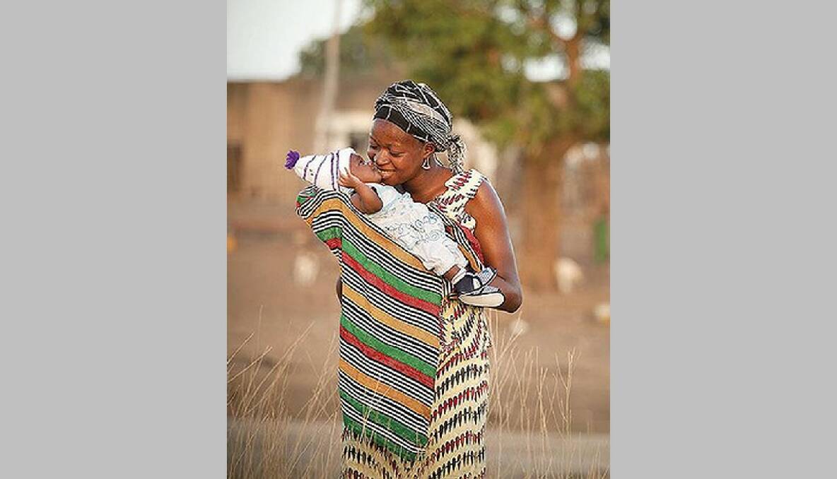 A mother’s joy: three-week-old Awa is peaceful under mother Rawata’s care in Senegal. Photo: Meg Hansen