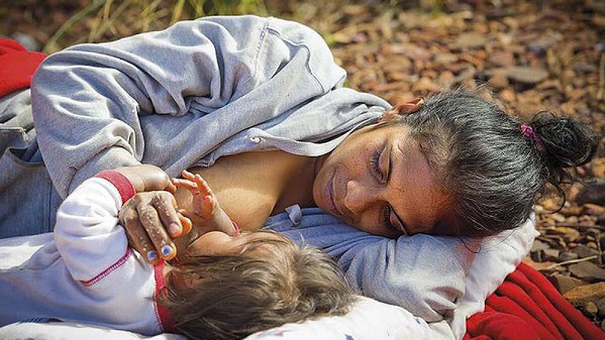A special moment between mother and child: Sheila breastfeeds baby Lettiona in the Pilbara, Australia. Photo: Luke Peterson