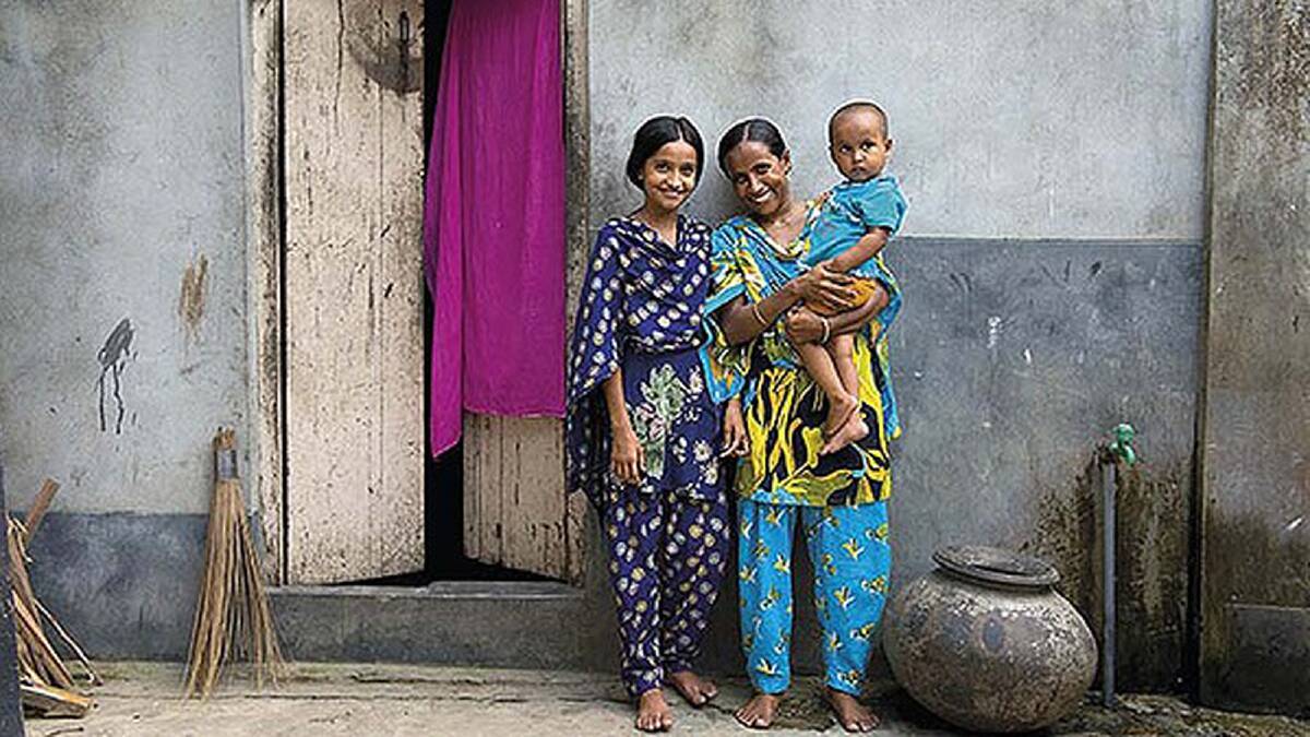 Rina from Bangladesh (pictured centre) worried when her older children became malnourished. She has been attending a mothers’ nutrition group and is overjoyed her daughter Eishi is healthy and gaining weight. Photo: Ken Duncan