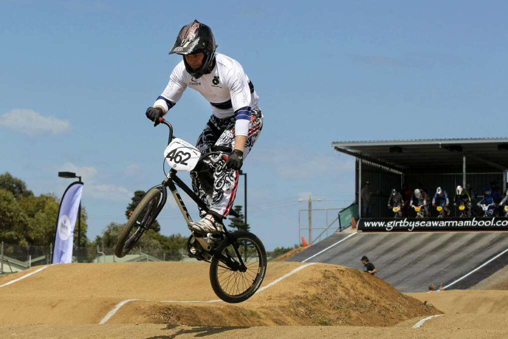 A BMX rider tests out the new track's jumps. 