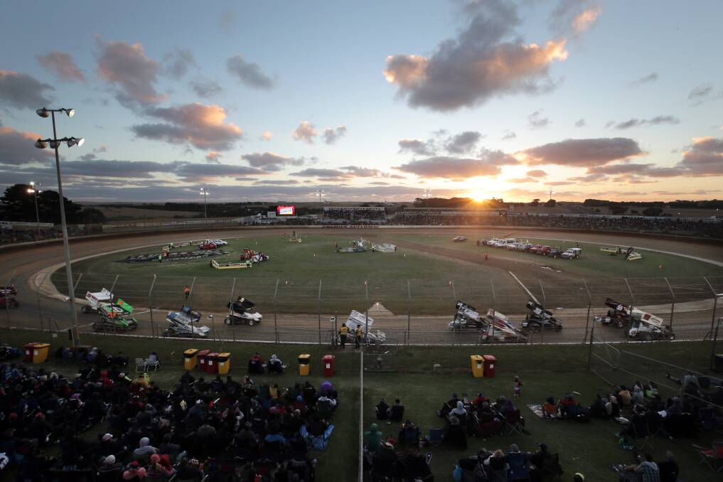 Sprintcars make their way around the Premier Speedway as the sun sets on Saturday. Picture: ROB GUNSTONE