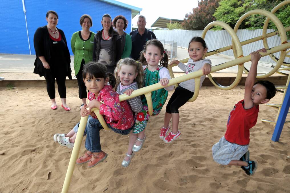 Early Years Learning and Development service manager Tina McLeod, Warrnambool City Council community services manager Kellie King, mums Chelsea Fry and Anthea Rafferty, and principal Gavin Arnott with children Milly Paton, 5, Hannah Amor, 5, Elka Rafferty, 4, and Rainbow Fry, 3, Max Fry, 5.