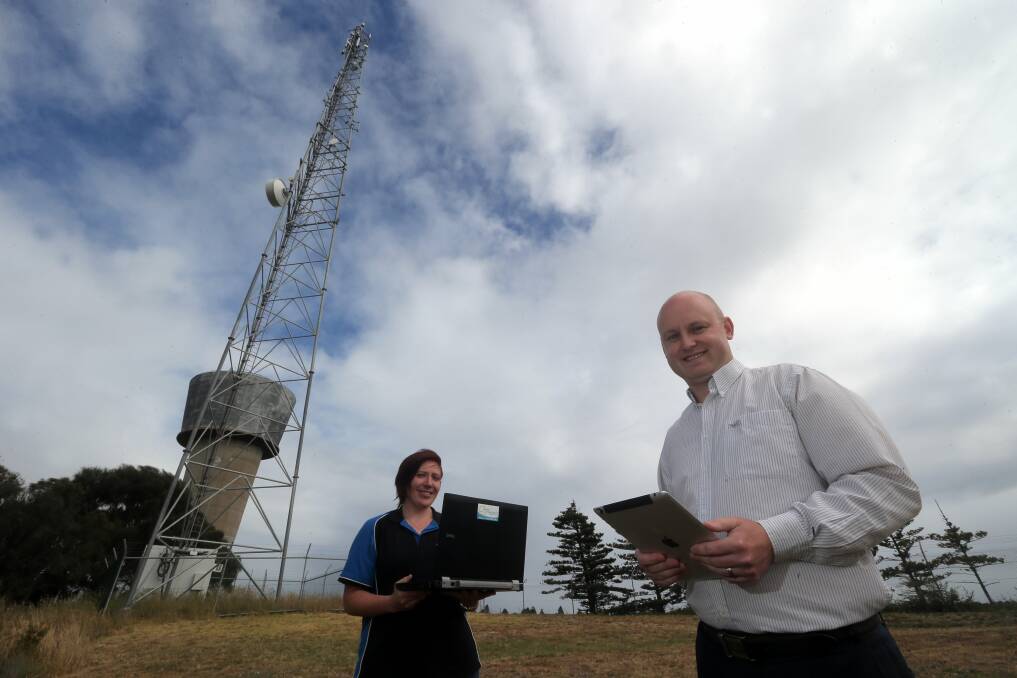 Network operations technician Wendy Gardner and Aussie Broadband's Aaron O'Keeffe at the Hyland Street communications tower.
