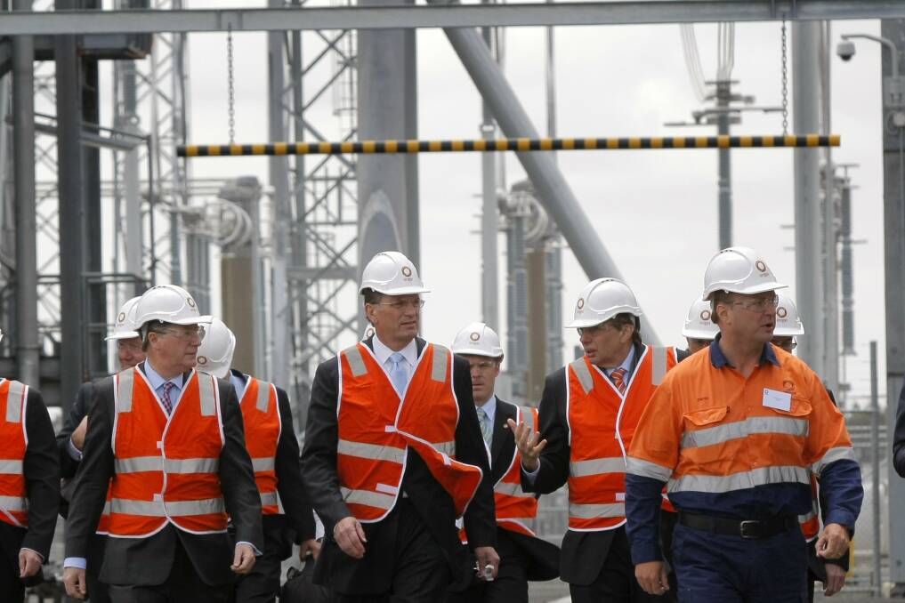 A plant technician leads Victorian Premier Ted Baillieu (centre) on a tour of the power station during yesterday's official opening, flanked by South West Coast MP Denis Napthine and Origin Energy managing director Grant King.