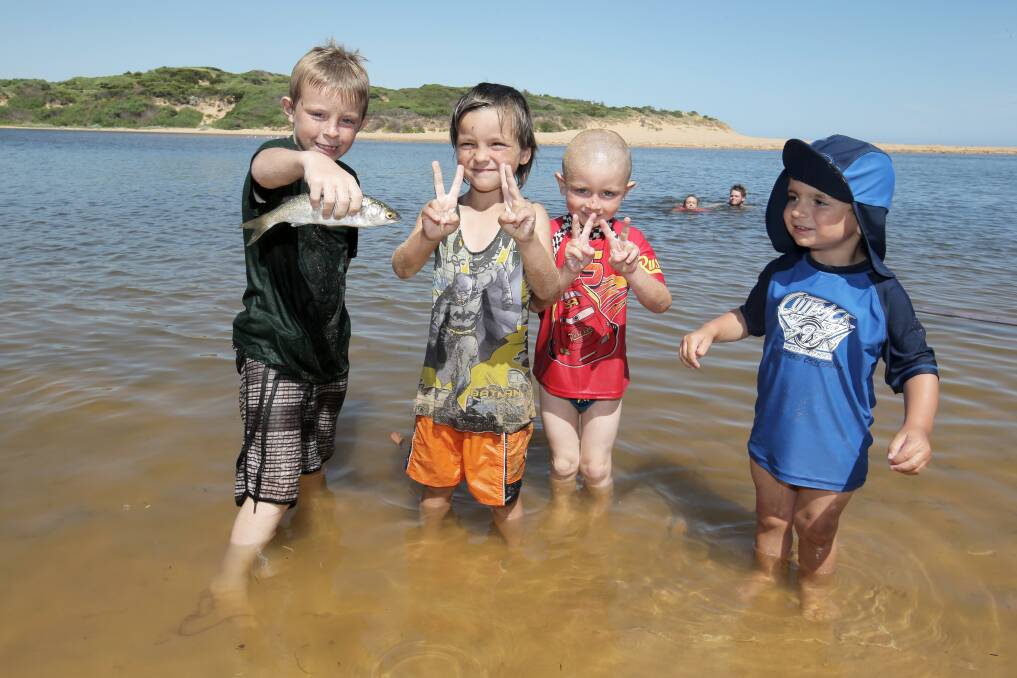 Brandon Grose, 8, Matthew Hogan, 5, Jake Grose, 4 all of Warrnambool, and Emre Meric, 2 of Terang, cool off in the water at Blue Hole. Picture: ROB GUNSTONE