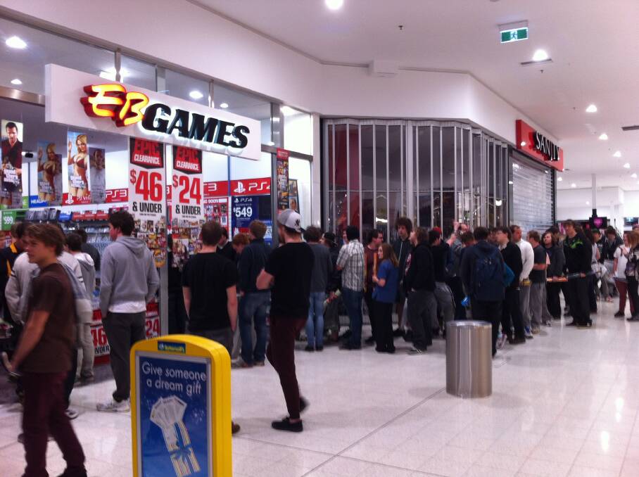 Gamers line up to collect their pre-ordered copies of Grand Theft Auto V at EB Games Warrnambool's midnight launch.