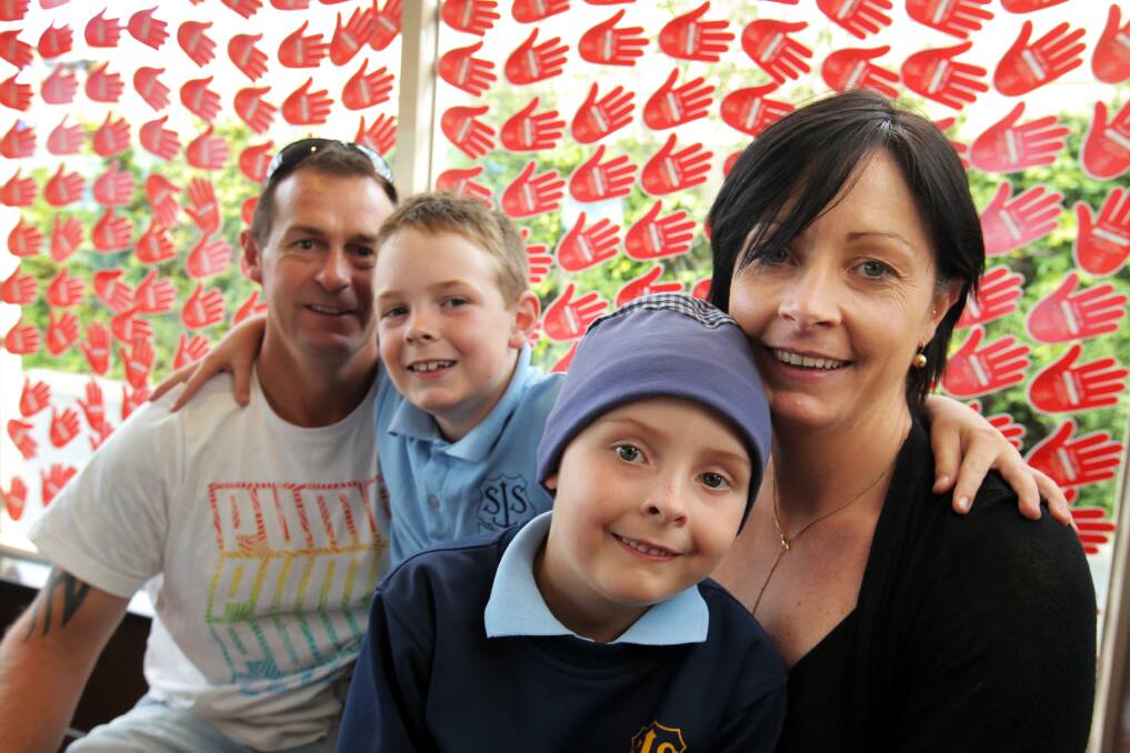 Regan Squires, 6 (with hat), with her family Jamie, Tye, 8, and Geradine Squires. The family has had to make use of Ronald McDonald House on a number of occasions, when in Melbourne for Regan's cancer treatments. Picture: ROB GUNSTONE