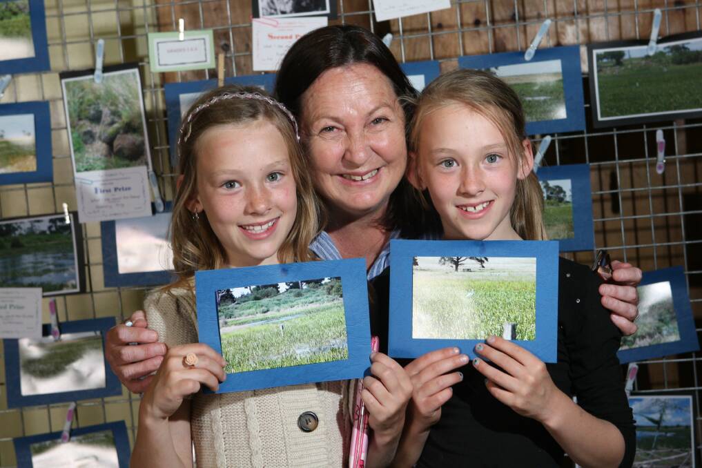 Emerson Fuss, 10, (left) with Mary Johnson from the friends of Yatmerone Wildlife Reserve, and Milla Fuss, 10. 