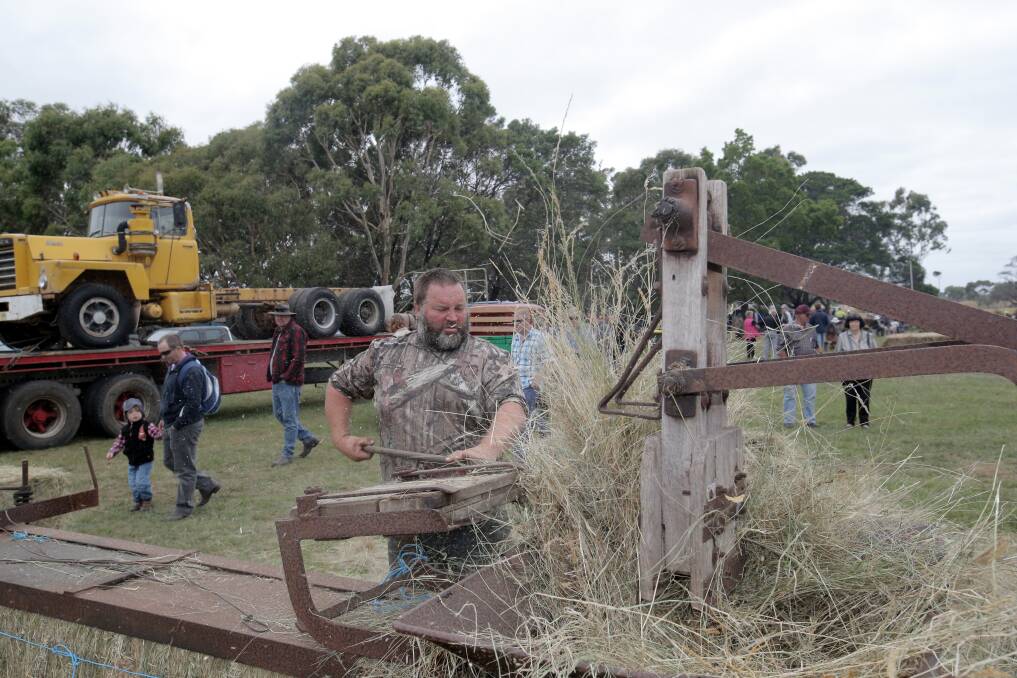 Brian Cockayne from Laang with a Cliff and Bunting stationary hay press from around 1920. Picture: AARON SAWALL