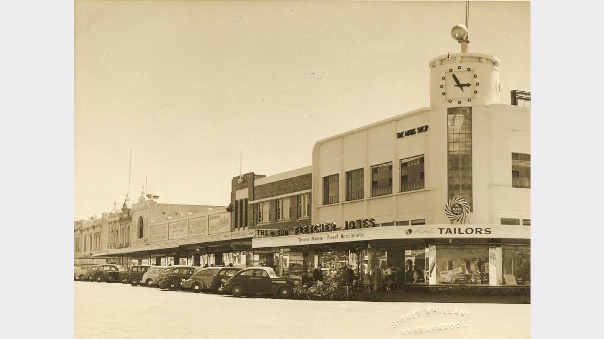 Fletcher Jones Mans Shop in the 1940s. The Mans Shop was sold in 1949 after the establishment of the Pleasant Hill Factory in Flaxman Street. The photo was taken by Sydney Willan, whose shop is just to the left of the darker brick buildings. SOURCE: Warrnambool & District Historical Society.