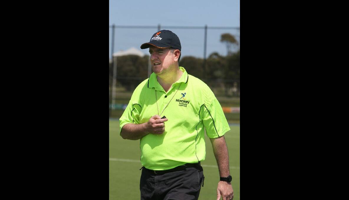 Jeff Sly, from Win News, umpires the hockey action.