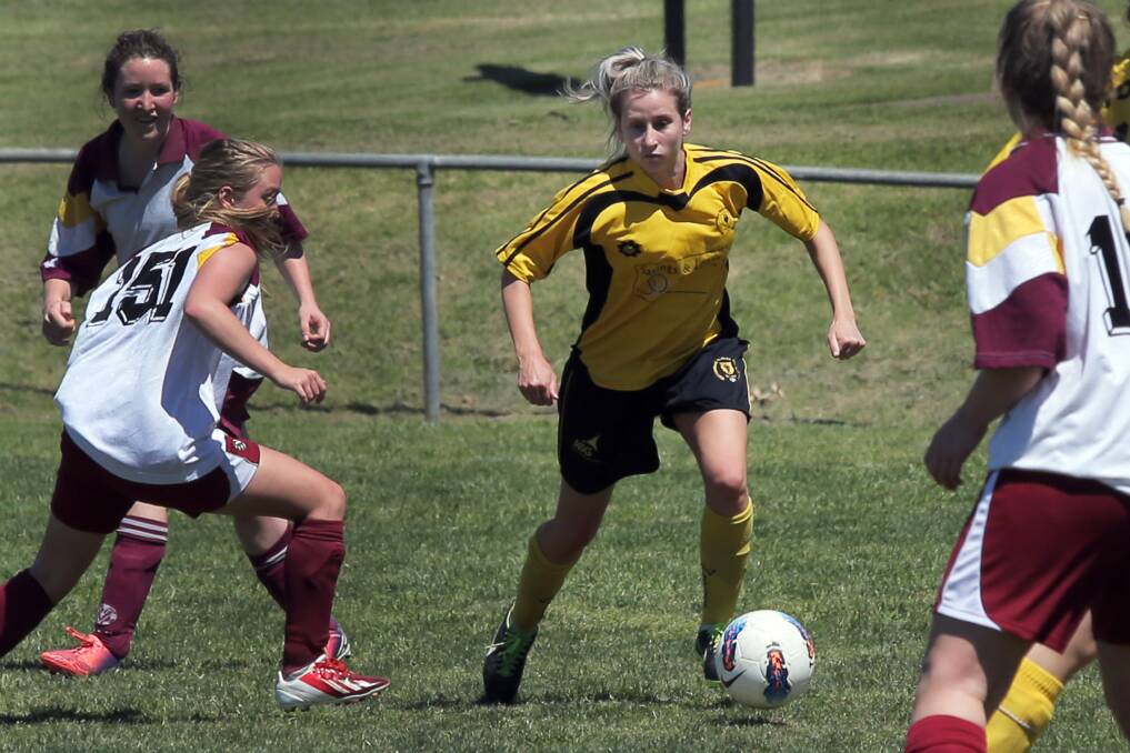 Warrnambool Wolves player Ellen Wines gets past her Monbulk opponent at the Harris Street Reserve as part of the South West Games. Picture: ROB GUNSTONE