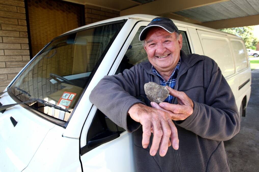 Warrnambool resident Ronnie Pickett holding a rock that was stuck in his windscreen about 6km from Nelson on the Portland side. The rock was thrown up  from a truck wheel because of bad roads.  Picture :LEANNE PICKETT