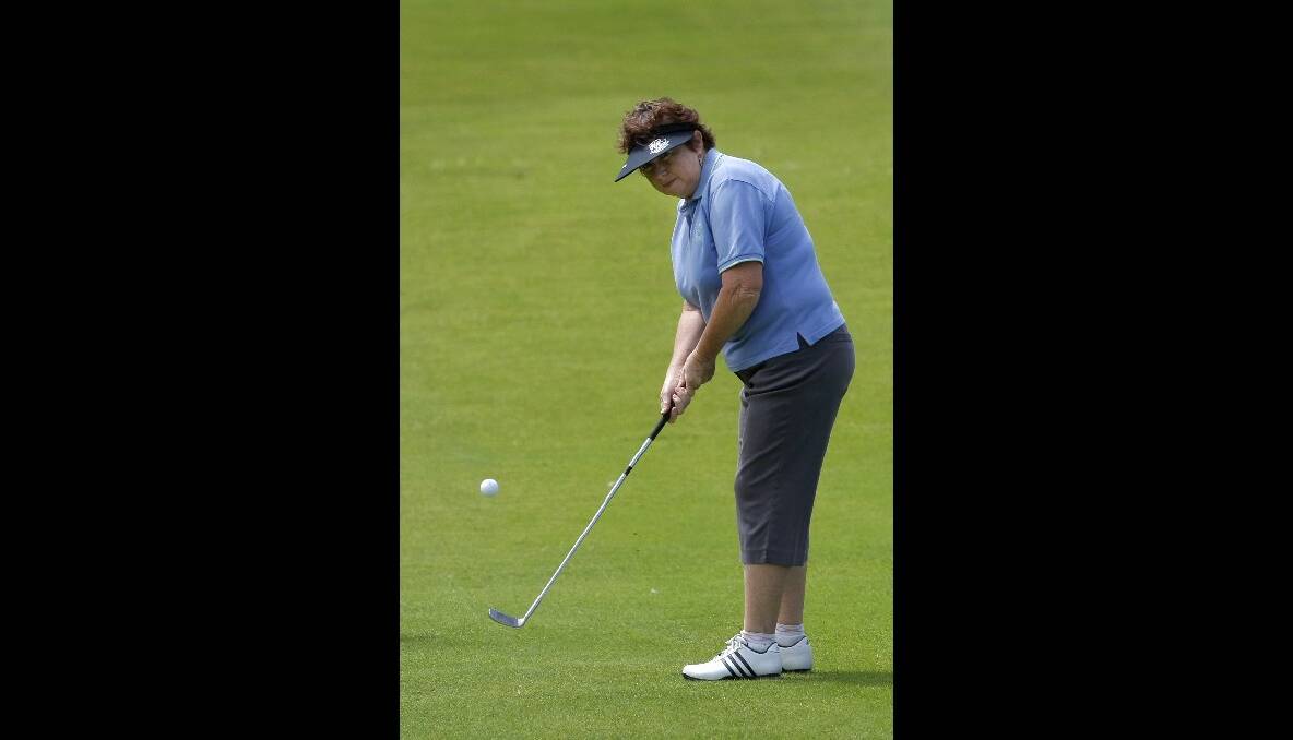  Marion McKenzie, of Warrnambool, chips to the green. 
