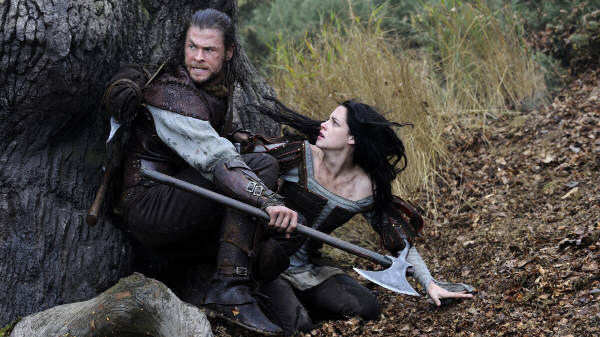 The Huntsman (Chris Hemsworth) is on hand to protect Snow White (Kristen Stewart) from the forces of fairytale evil.