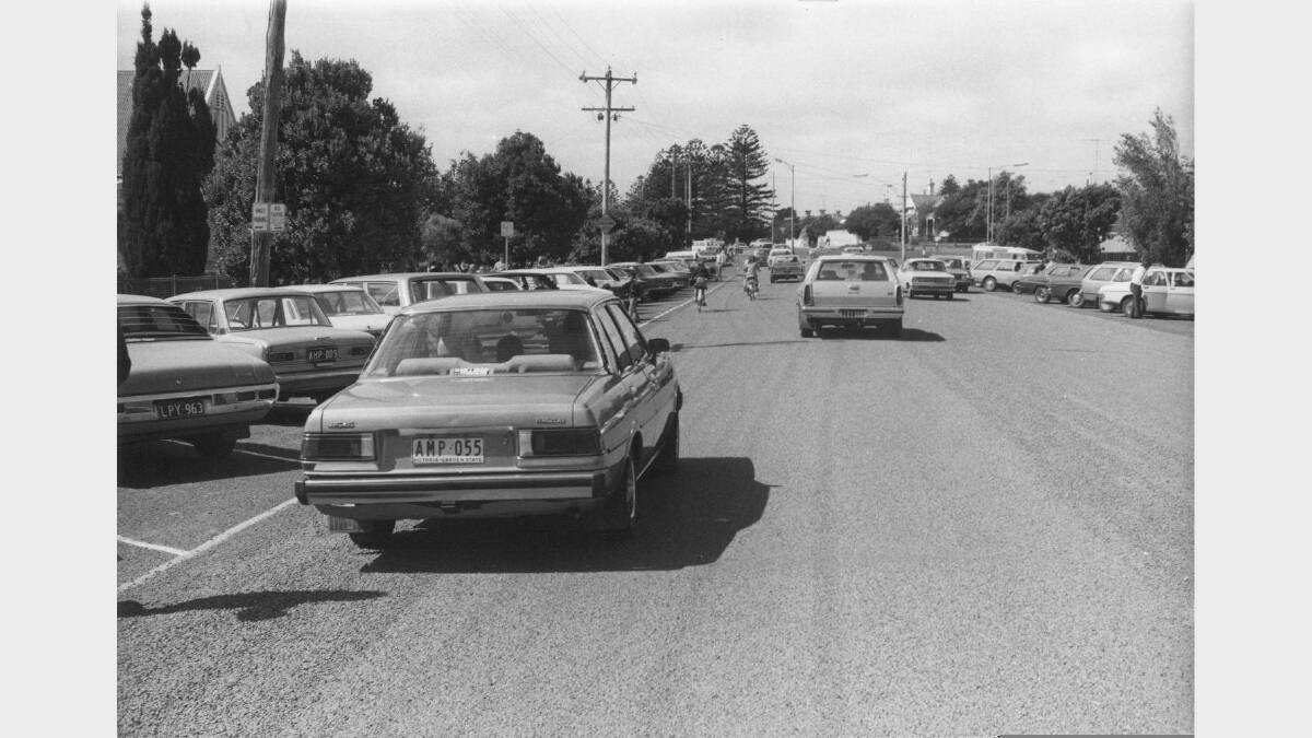 Children riding to school among the traffic on Jamieson Street in the 1970s. SOURCE: Warrnambool & District Historical Society.