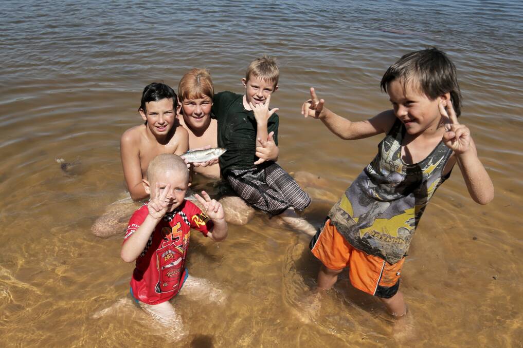 Jake Grose, 4, Mark Foster, 13, Andrew Grose, 14, Brandon Grose, 8, and Matthew Hogan, 5 all of Warrnambool, cool off in the water at Blue Hole. Picture: ROB GUNSTONE