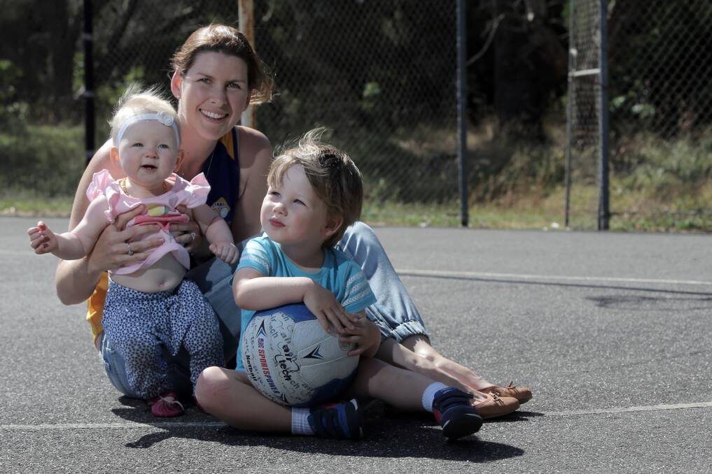 Liz Byrne is returning to playing netball with the State League Warrnambool City side, plus South Warrnambool - pictured with daughter Sophie, 1, and son Finn, 3. Picture: ROB GUNSTONE