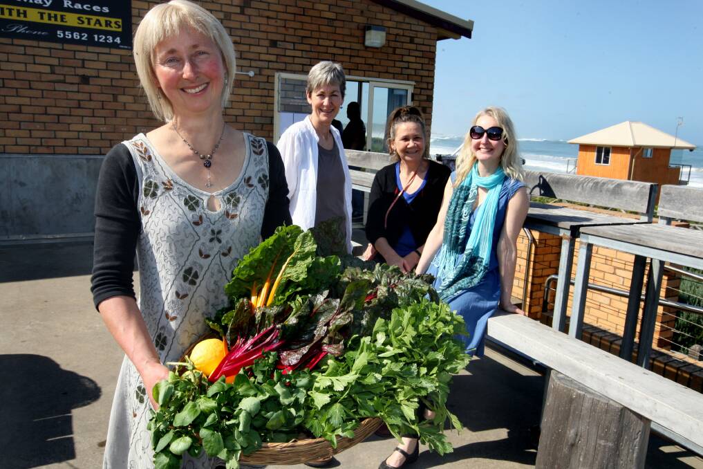 Produce swap organiser Kylie Treble with a basket full of fresh produce. Behind her are Kate Scanlan, Wendy Stephens and Loretta Gurnett. Picture: DAVE LANGLEY