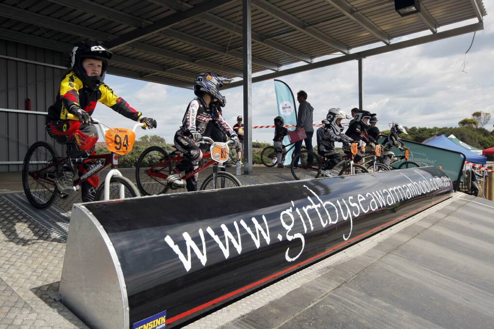 Riders sit and wait at the new starting gate, before racing around the new BMX track built at Jetty Flat. 
