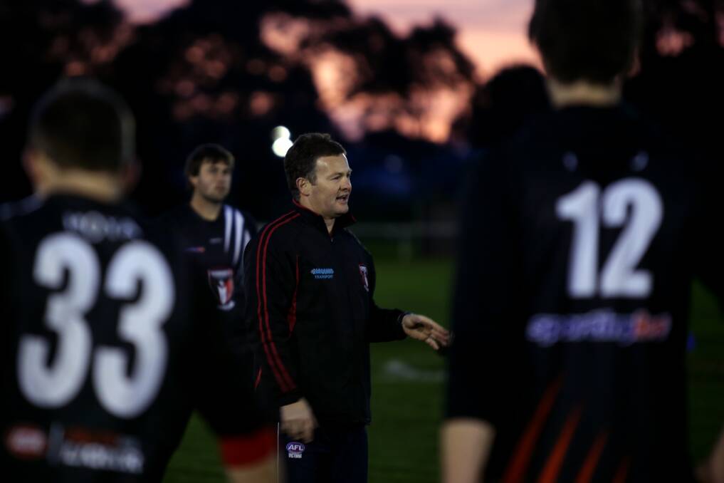 Koroit coach Adam Dowie talks to his players before training. Picture: ROB GUNSTONE