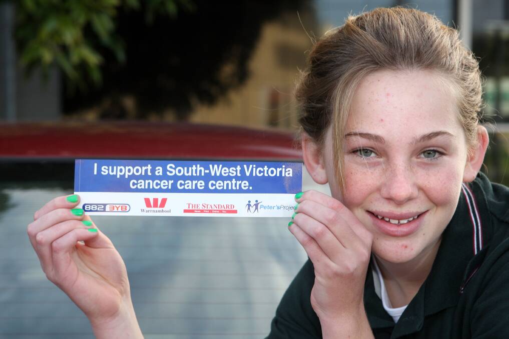 Support for Peter's Project grew quickly in the local community. Pictured with a bumper sticker in 2010 is student Cassandra McCosh from Mailors Flat.