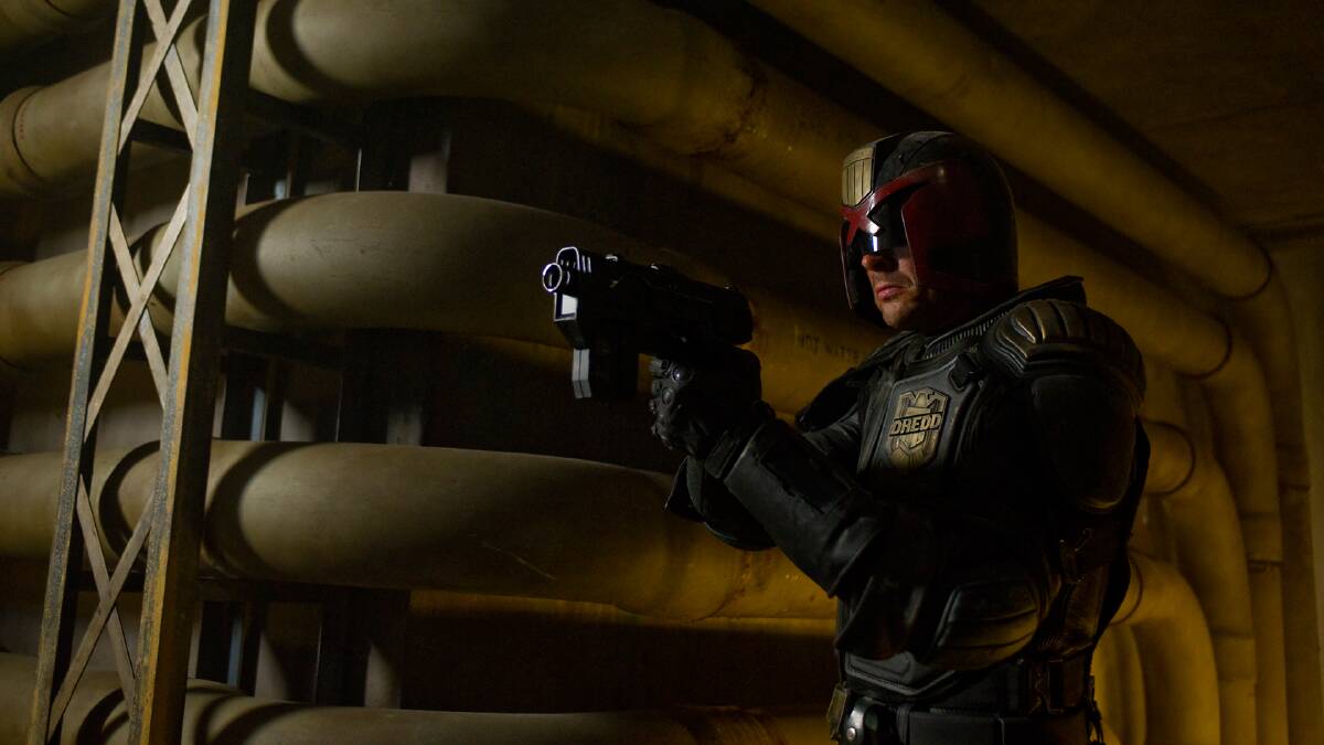 Karl Urban plays Dredd, but unlike Sylvester Stallone's 1995 portrayal, he leaves the mask on.