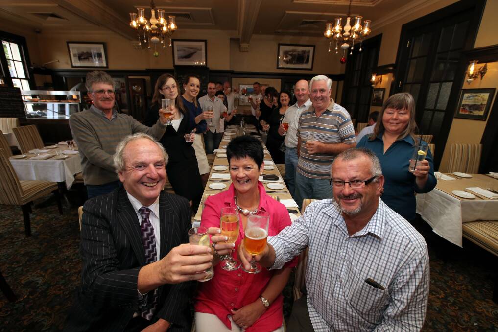 Counsel Tim Tobin (front left) and Jo and Terry Place celebrate their Powercor settlement, along with other landholders and staff from Maddens Lawyers at Hotel Warrnambool.