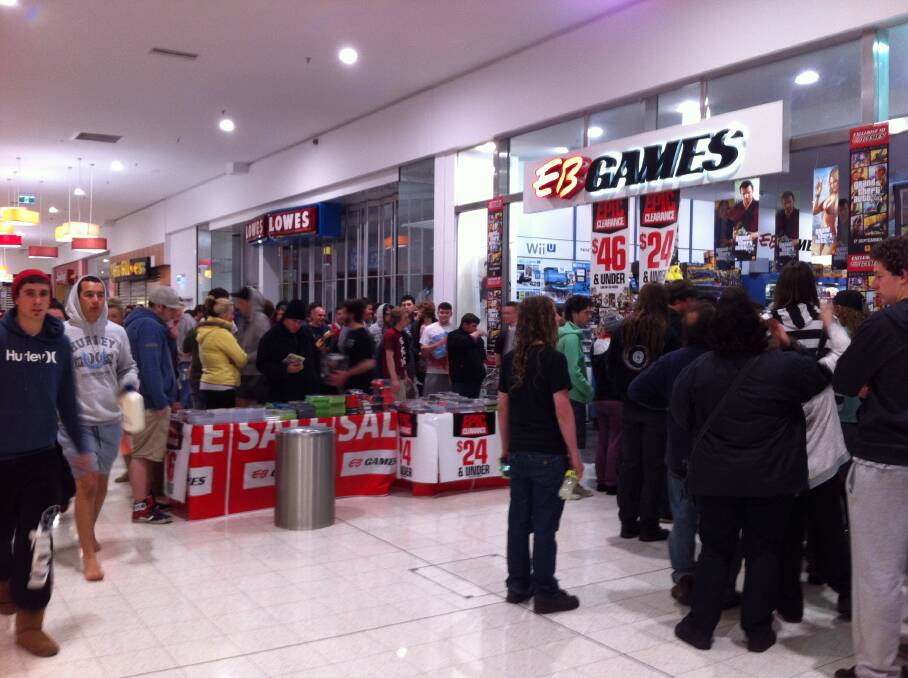 Gamers line up to collect their pre-ordered copies of Grand Theft Auto V at EB Games Warrnambool's midnight launch.