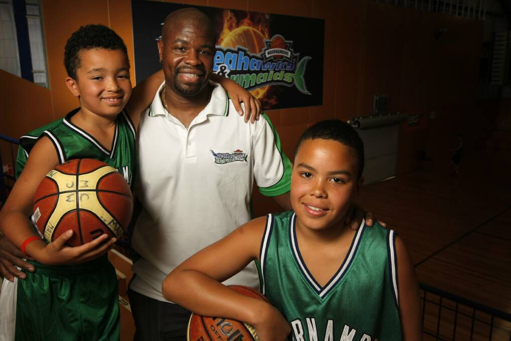 Malakye (left) and Ashaan Cunningham get tips for this weekend's Seaside Junior Classic from their dad Bobby.