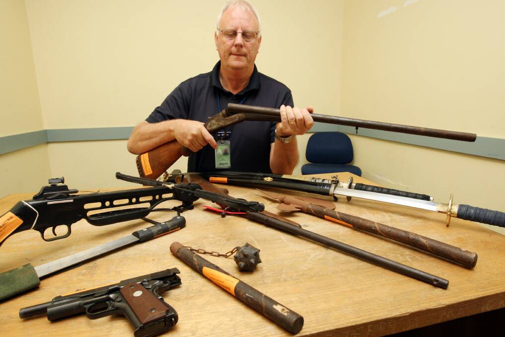 Warrnambool Police Station property manager Don WIlson with weapons recently handed in.